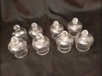 Lot de 8 anciennes ventouses à téton en verre